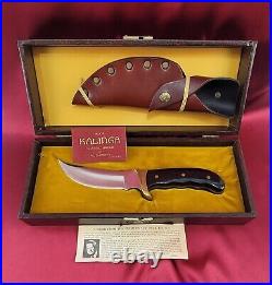 Buck 401 Kalinga knife with original leather sheath papers and display case